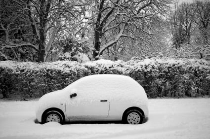 Image of snow on white car