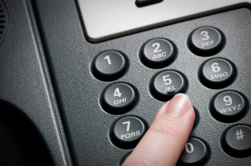 woman using a VoIP conference phone