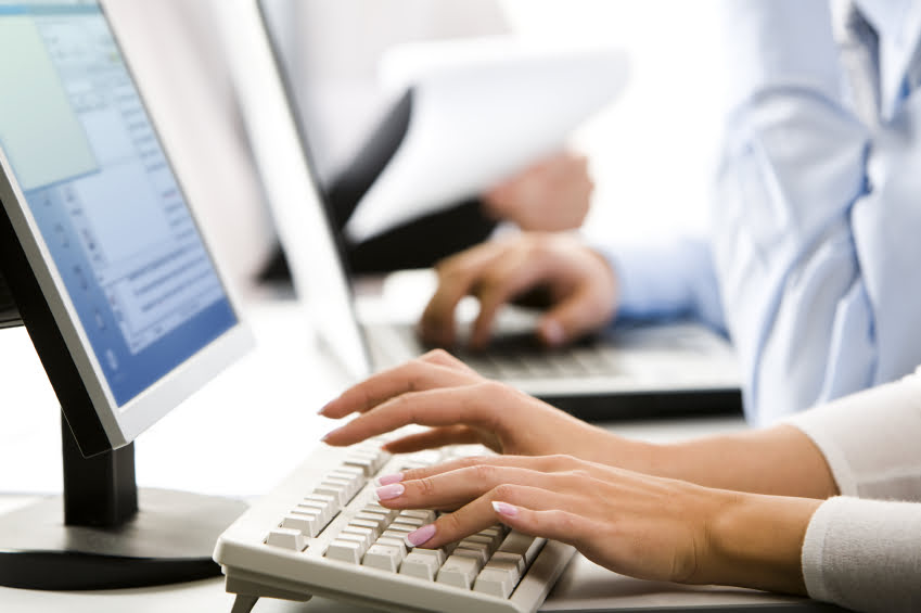 woman typing on a keyboard